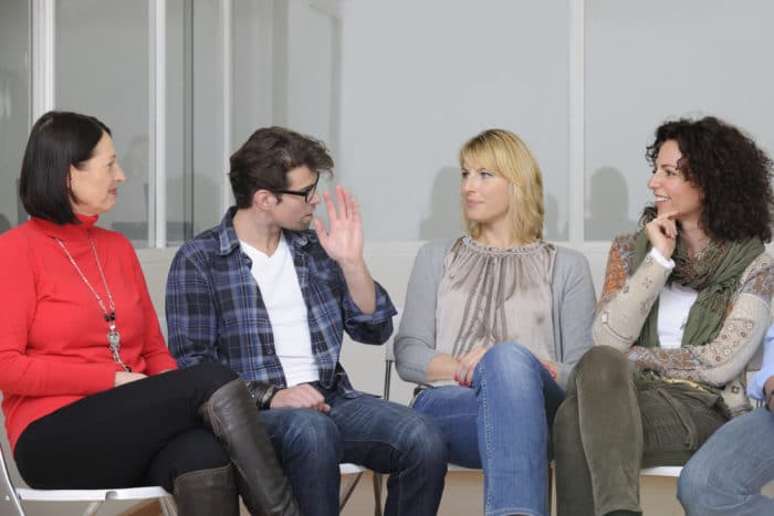 Cognitive behavioral therapy can be used in a group setting to help with anxiety People in cognitive behavioral therapy group session for insomnia treatment