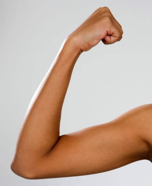 photo of person doing progressive muscle relaxation with arm to relax for sleep