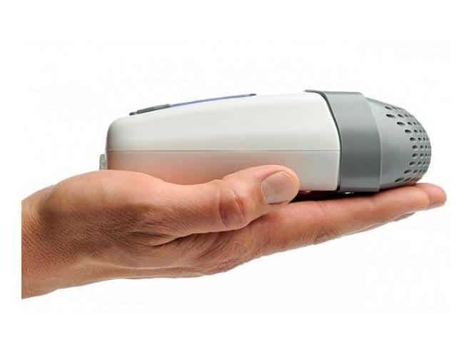 portable CPAP machine in the palm of a hand