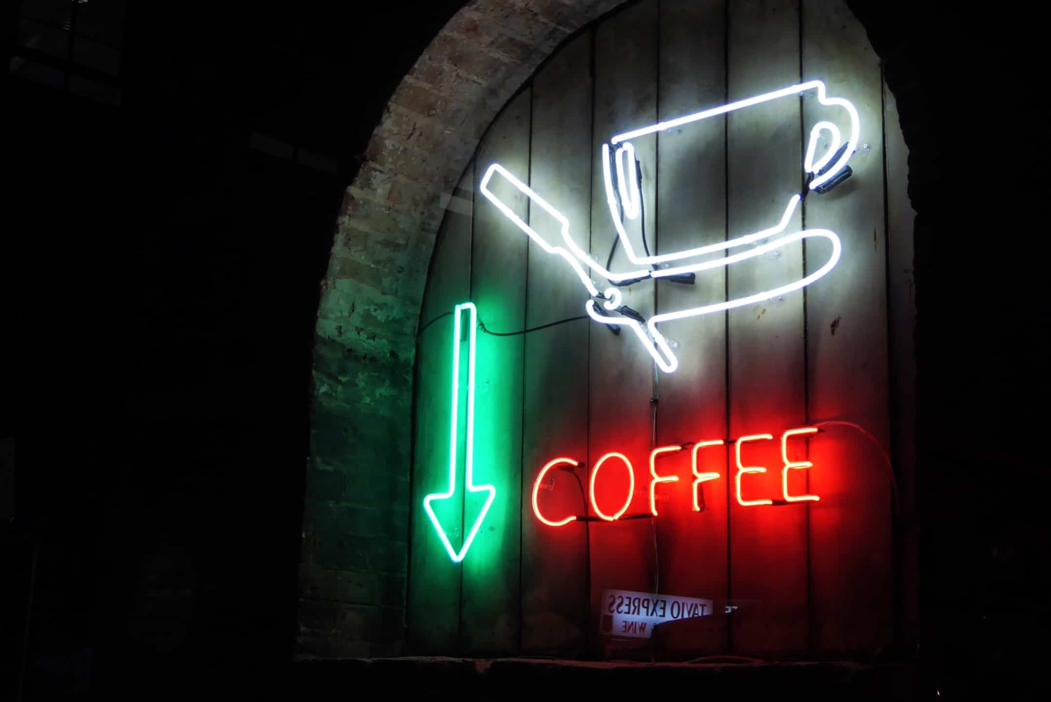 coffee cup sign on a coffee shop open for people to get a late night caffeine fix