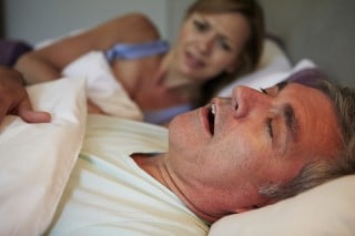 Snoring can be a real nuisance to a bedmate wife woken up by husband snoring