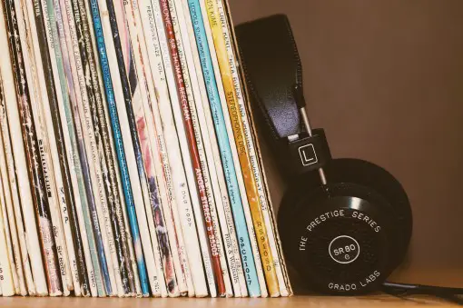 picture of headphones next to music albums for insomnia treatment