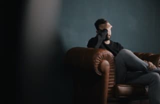 Psychotherapy can help with the biological, psychological, and emotional factors involved with pain picture of man receiving counseling for pain management