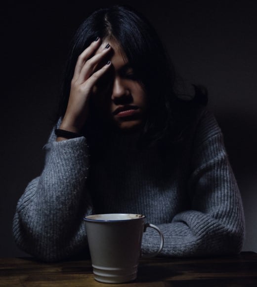 woman with a racing mind wondering how to go to sleep