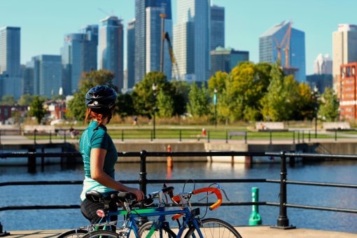 woman bicycling on a sunny day to help her sleep