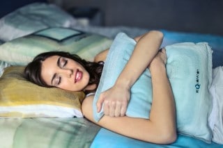 Sleep can help nausea, but you need to figure why you’re sleeping so poorly picture of lady resting peacefully in bed so sleep can help her nausea