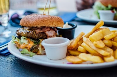 photo of hamburger and fries which is the type of meal to avoid if you’re falling asleep during meetings 