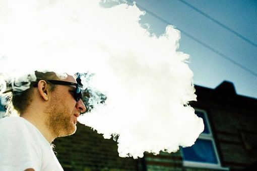 You may want to rethink sleep apnea and vaping man smoking e-cigarette wondering about sleep apnea and vaping