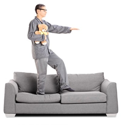 It’s not just kids, a sleepwalking prevention device could help this guy too man walking on couch who needs a sleepwalking prevention device