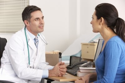 A sleepwalking prevention device can be useful, but don’t forget to do something about the triggers... man who uses a sleepwalking prevention device talking to a doctor about his triggers