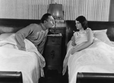 When couples aren’t getting the sleep they need, relationships suffer photo of couple awake at night arguing and upset