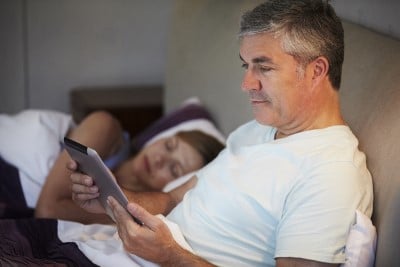 Knocking off before a spouse may help if you’re sleeping with someone with sleep apnea women asleep in bed before husband who has sleep apnea