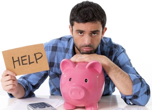 man with piggy bank and help sign