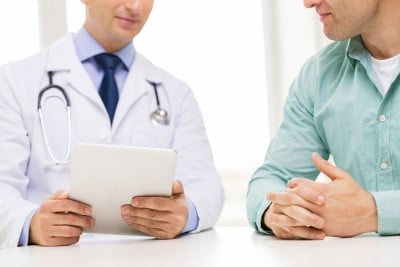 Your doctor can help you figure out which meds could be causing sleep problems Man reviewing meds with doctor