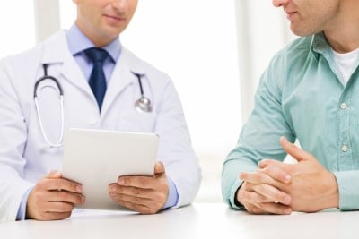 Man reviewing meds with doctor