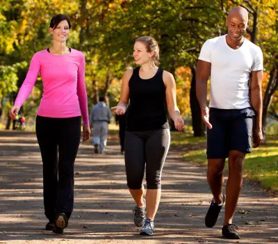 people walking in the park to keep their jet lag from causing depression