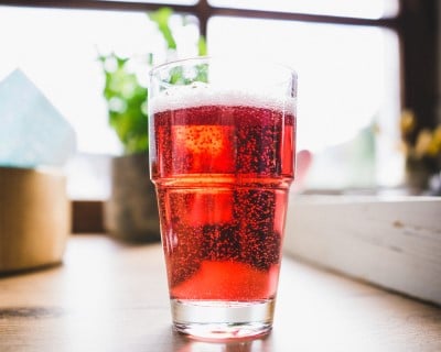 glass of carbonated water mixed with fruit juice