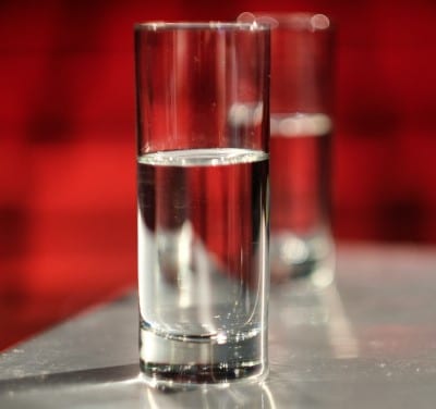 photo of glass of water which can help if feeling tired after retirement from dehydration