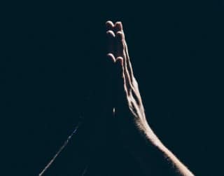A little time spent in quiet prayer can pass the time and put you in the right frame of mind picture of praying hands