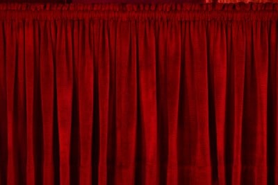 red heavy drapes covering window