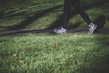 Staying active will help if politics is keeping you up at night woman walking during day because politics is keeping her up at night