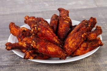 barbeque wings on plate, a bad snack when you’re too hungry to sleep