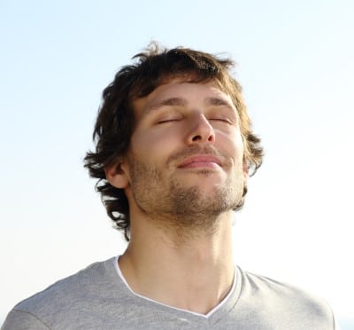 photo of man doing breathing exercise