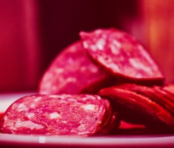 sliced pepperoni on table