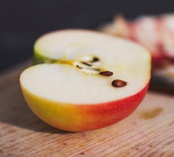 sliced apple on cutting board ready to eat for someone too hungry to sleep