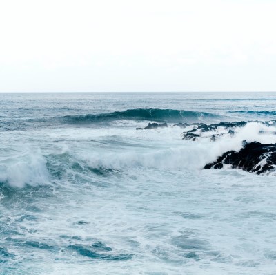 photo of ocean waves which can help with sleep so you don’t wake up late for work