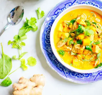 photo of bowl of vegetable stew seasoned with turmeric to aid relaxation