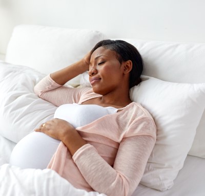 photo of woman getting extra sleep to help her stay awake at work while pregnant