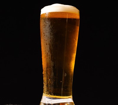 photo of person glass of beer to have before bed