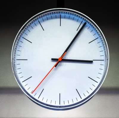 photo of clock with meeting time which is one thing to change if you’re falling asleep during meetings
