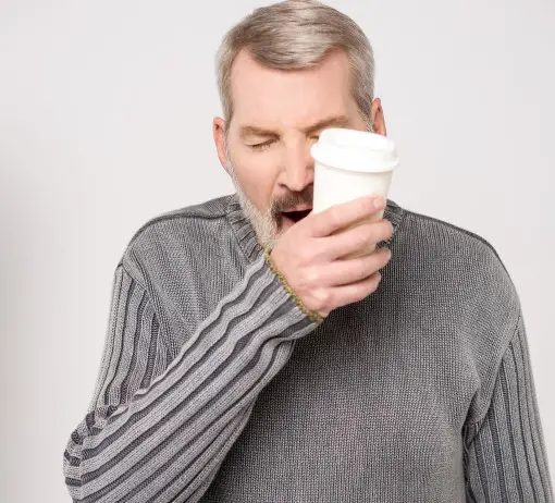 CPAP users with acne should look at their sleep too photo of exhausted and yawning man which is another reason CPAP users may have acne