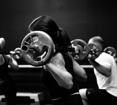 photo of people working out with weights