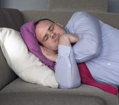 A well timed nap may make a difference if a husband is always falling asleep photo of man napping on couch which can help if a husband is always falling asleep