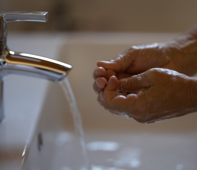 photo of person in bathroom for a cold water splash to help them stay awake at church 