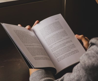 A little light reading may help if you can’t sleep after moving photo of person can’t sleep after moving who relaxing with a book