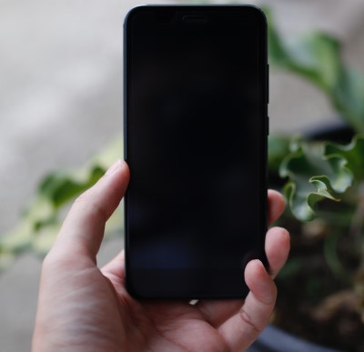 Powering down your phone may do the trick... photo of person turning their cell phone off