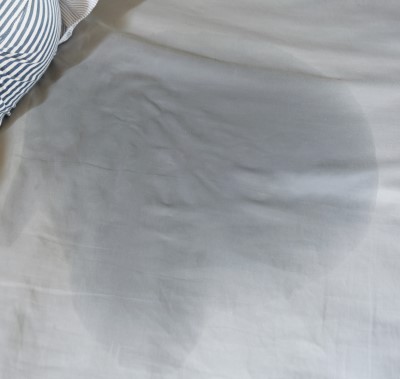 Accidents can make for an unpleasant wakeup photo of wet spot on mattress