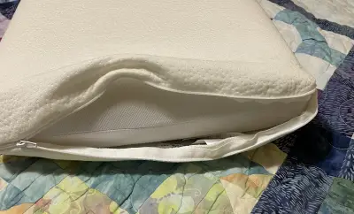 The Panda pillow's cover unzips for easy washing photo of Panda pilow showing cover unzipped