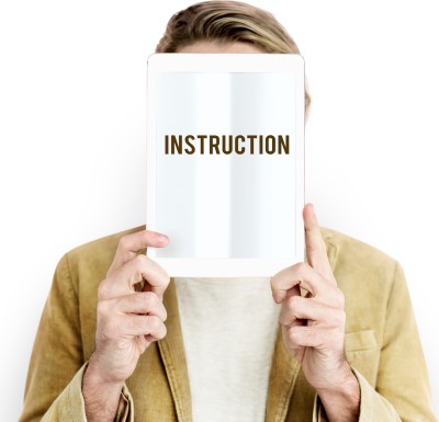 photo of man holding instructions 