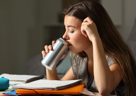 photo of teen consuming an energy drink