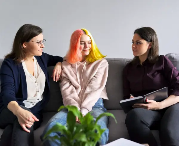 photo of teen with therapist to help them sleep better