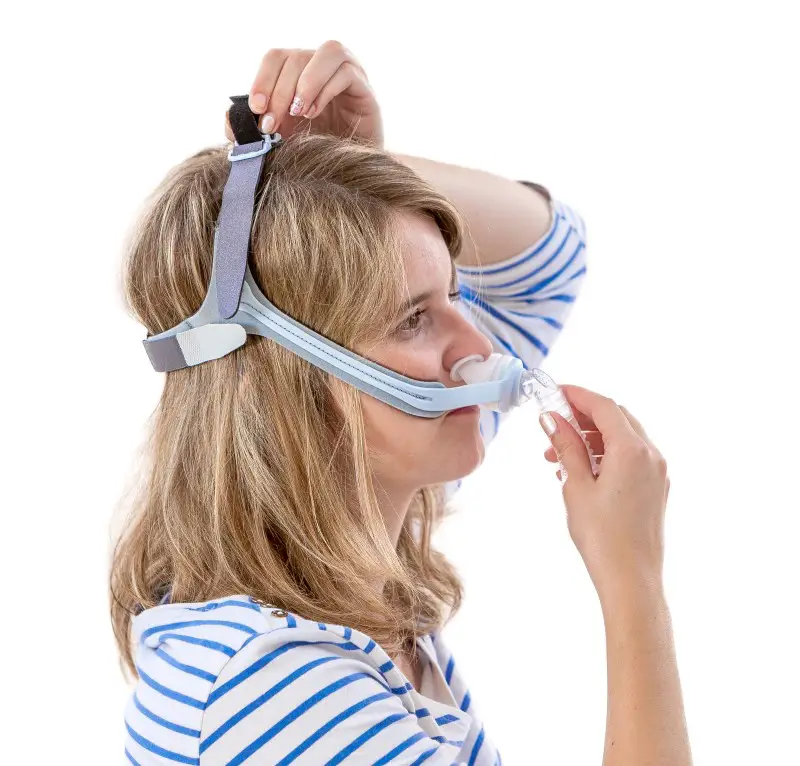 photo of lady practicing with mask to help with CPAP anxiety