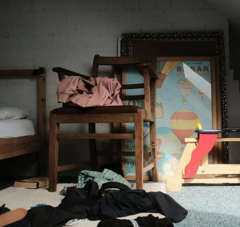 Try decluttering your room if sleeping with allergies photo of a clutter room which makes it harder to sleep with allergies