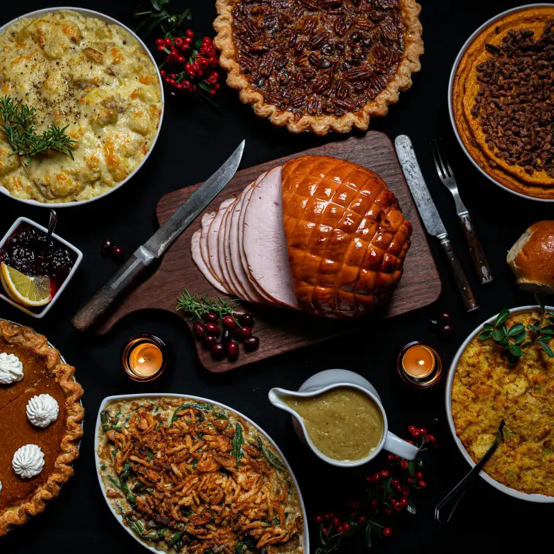 table set with rich holiday foods likely to cause insomnia