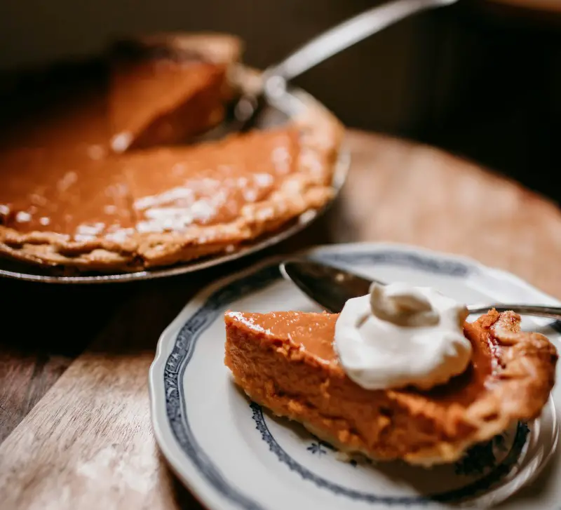 a slice of pumpkin pie on a plate